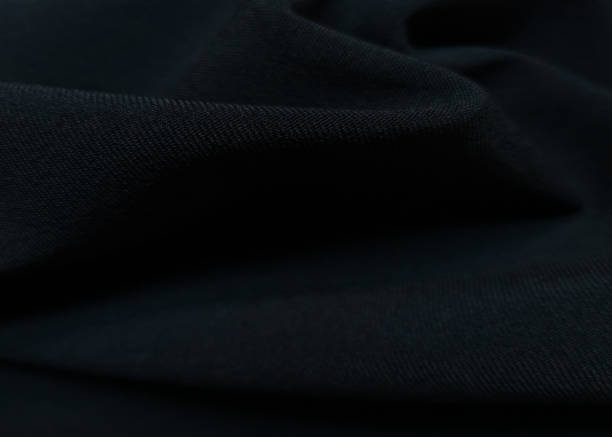 istock Dark blue crumpled or wavy fabric texture background. Abstract linen cloth soft waves. Creases of satin, silk, and cotton. Smooth elegant silk or atlas luxury cloth texture. Bedding Sheets or blanket 1355808489