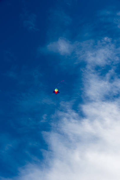 istock Colorful Kites flying over the sky 1355812803