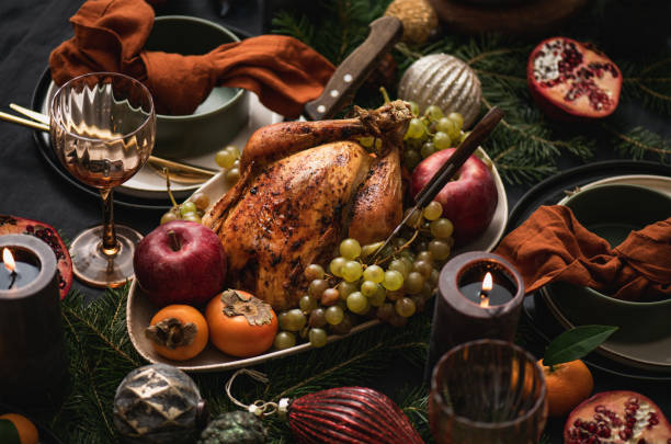 istock Festive dinner with whole roasted chicken and decorations 1355813824