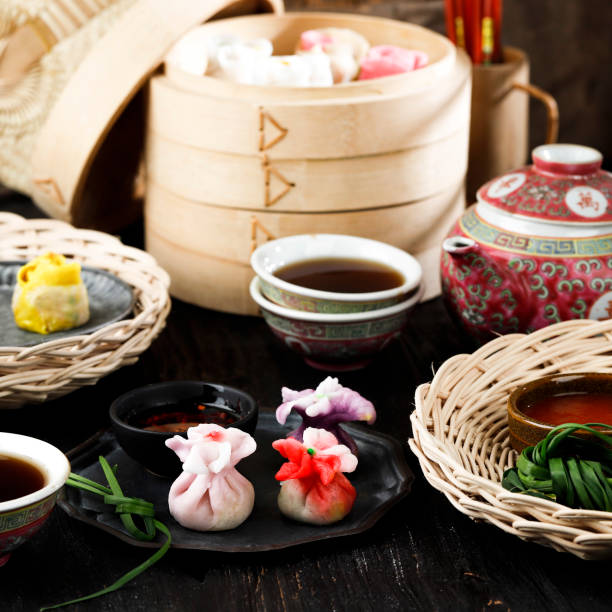 istock Chinese Dumpling, Beautiful Colorful Dim Sum on Bamboo Stemaer. Concept Chinese Snack (Dim Sum) Served with Tea at Family Gathering during Chinese Festival, Dongzhi, Lantern, New Yea, Mid Autumn 1355814830