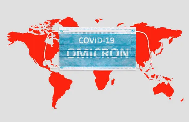 Photo of Face masks with inscriptions Covid 19 Omicron . Covid 19 alpha, beta, gamma, delta, lambda, mu, omicron variants outbreak around the world.