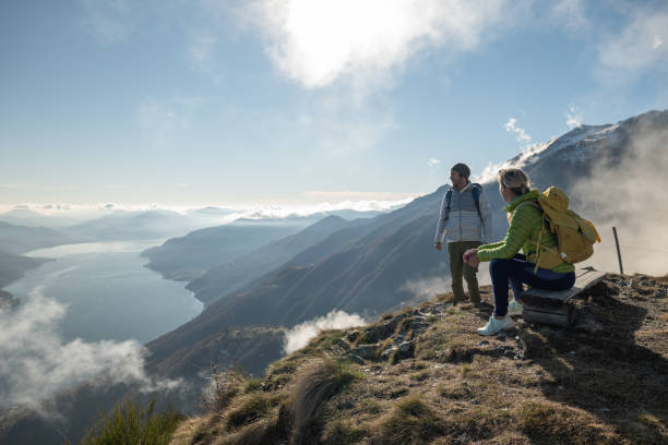 istock Young couple hiking contemplating view 1355819073