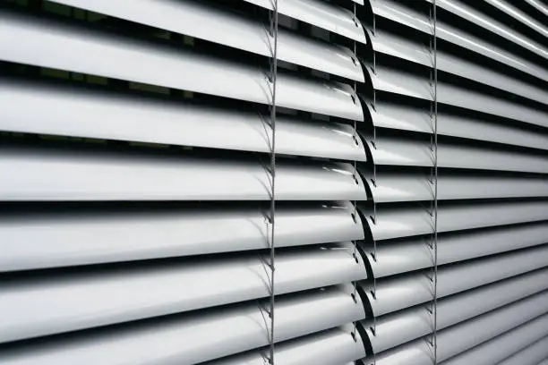 Blinds as sun protection on the window of an office building in Berlin in germany