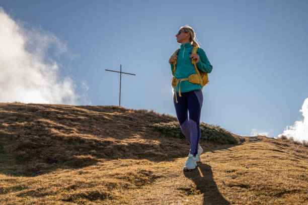 istock Young woman hiking in Switzerland 1355820914