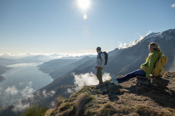 istock Young couple hiking contemplating view 1355821893