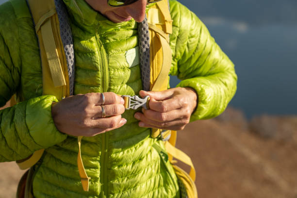 istock woman hiking adjusting jacket 1355822185