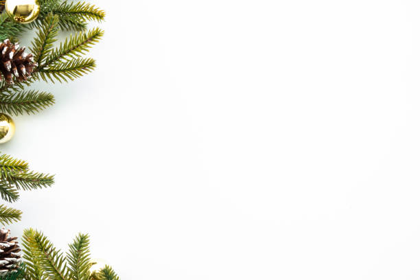 istock White table with Christmas decoration including pine branches and pine cones with golden balls. Merry Christmas and happy new year concept. Top view with copy space, flat lay. 1355822360