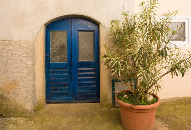 An old wooden door in the historic hill village of Vrbnsk, on Krk island in the Primorje-Gorski Kotar County of western Croatia