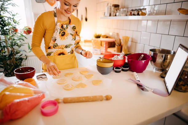 istock Woman makes muffins 1355825960