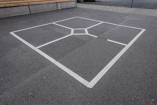Markings for the game Ruta or King at a schoolyard.