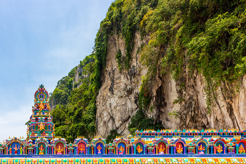 Colorful roof of Hindu temple decorated with small statues of Ganesha in the Batu Caves near Kuala Lumpur, Malaysia
