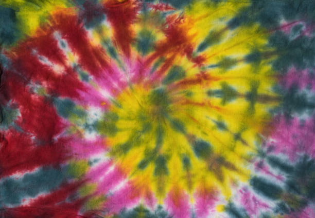 istock Fabric dyed with colorful beautiful tie dye style. Flat lay. 1355834944