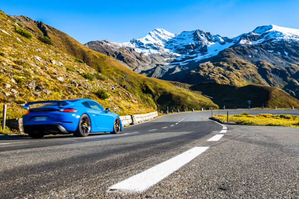 car at a road at the Grossglockner Mountain Grossglockner, Austria - September 23: car at a country road at the Grossglockner Mountain on September 23, 2021 grossglockner stock pictures, royalty-free photos & images