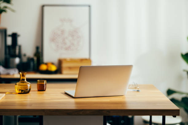 Workplace desk at home with laptop on it.