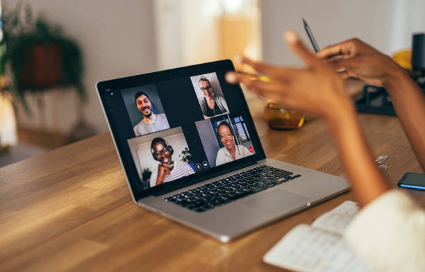 istock Anonymous Woman Having a Conference Call on her Laptop 1355840288
