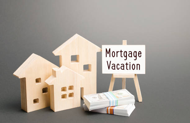 Mortgage vacation on a signage with mini houses and cash