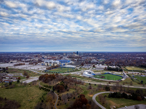 University of Kentucky stadium and Arboretum on the foreground. Distant view of the downtown district of Lexington KY on the background