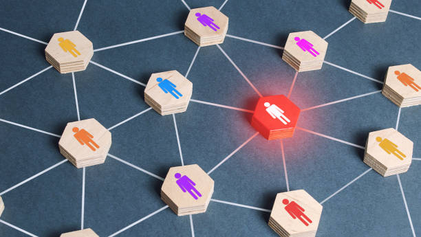 istock Red human figure in a network. Cooperation, collaboration. Spy. Employee replacement. Weak link, toxic worker. Security threat. Leader and leadership skills. Teamwork of a talented professional worker 1355842810