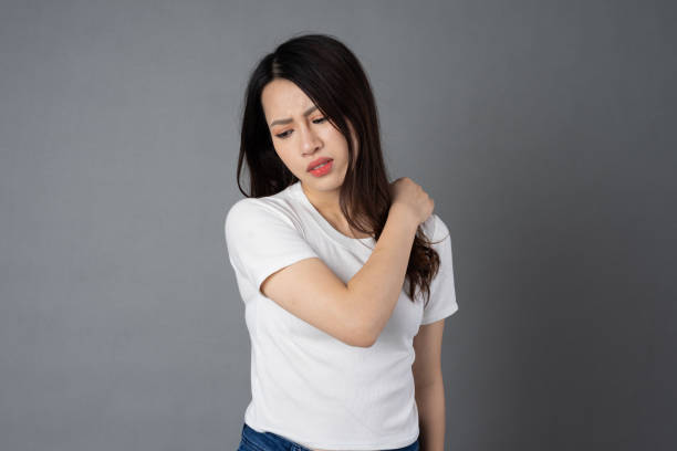 istock Asian girl portrait sitting on white cube, isolated on blue background 1355843859