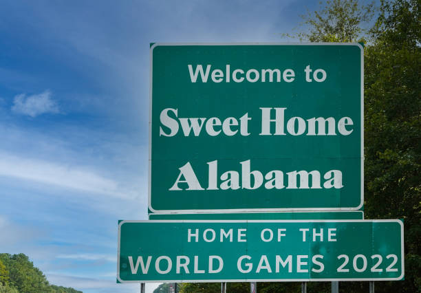 istock State Line Sign to Alabama, USA 1355845079