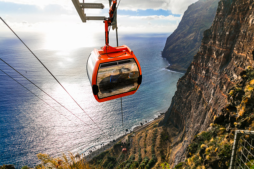 Road from the sky to the beach - mountain cable car Cabo Girao, popular tourist attraction and beautiful scenery in Madeira island