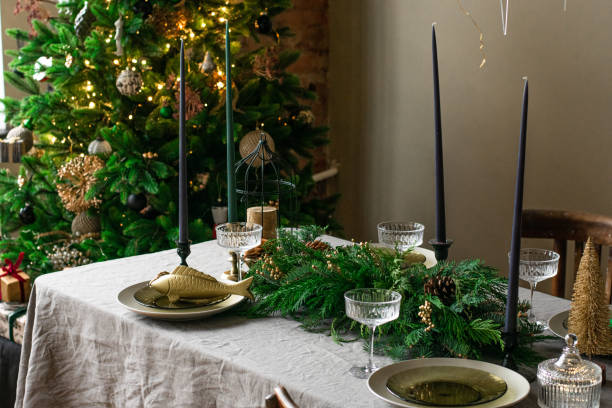 istock A decorated christmas dining table with christmas tree. Restaraunt menu 1355846227