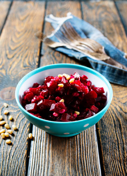 istock Vinegret is a salad in Ukrainian cuisine. It includes diced cooked vegetables (beetroots, potatoes, carrots), chopped onions and brined pickles 1355848217