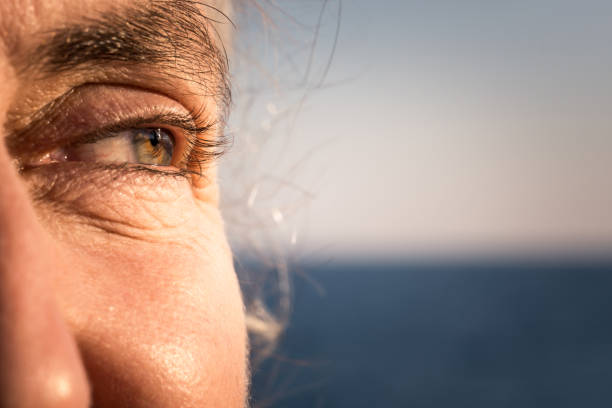 istock close-up old woman face shot 1355849014