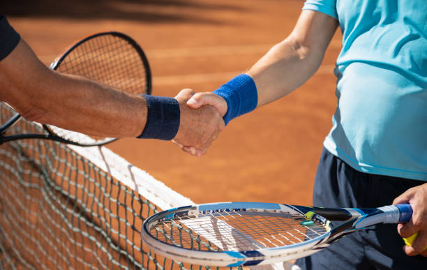 istock Two Tennis Players Handshake After Game 1355849112