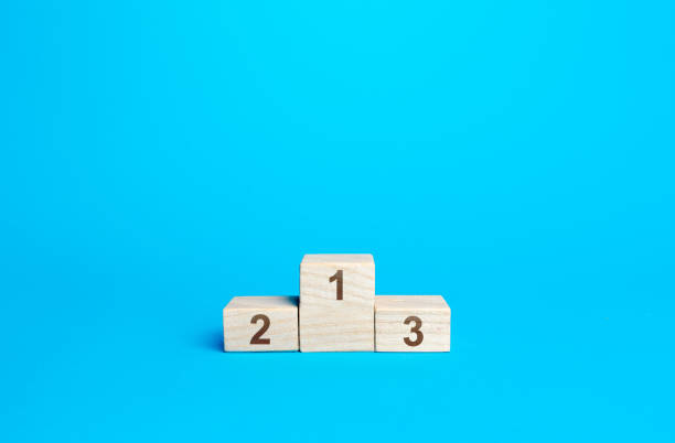 istock Sports podium awards on a blue background. First second and third place. Competition and concept. Summing up the results of contest. Empty prize places, canceled competitions. 1355850454