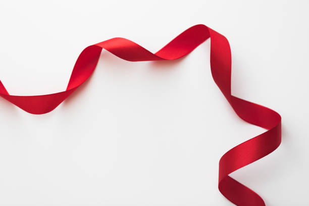 istock loops of red  ribbon on gray text place - Image 1355852500