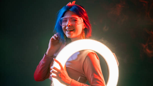 istock neon light people futuristic style woman led ring 1355854530