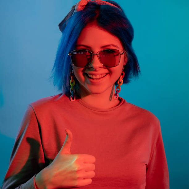 istock approval gesture agree sign neon woman thumbs up 1355854534