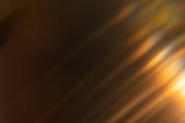 istock blur light overlay lens flare rays golden black 1355859556