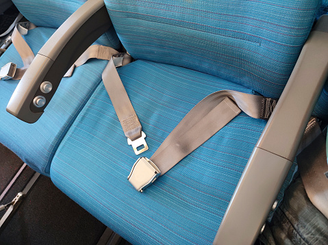 Seat belts on the passenger seat of the aircraft