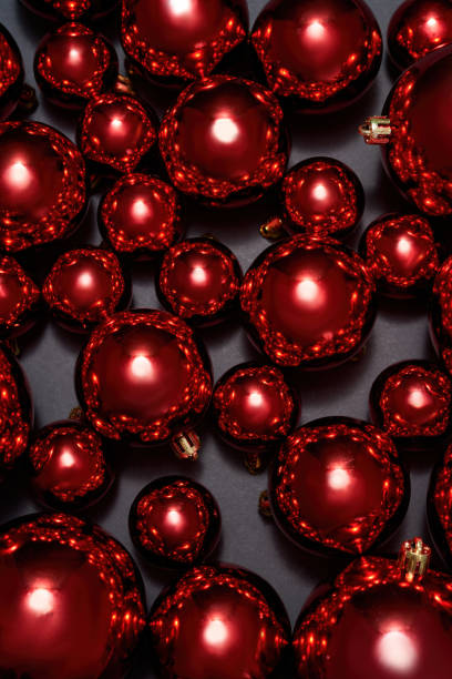 istock Set of red christmas balls on black background 1355869160