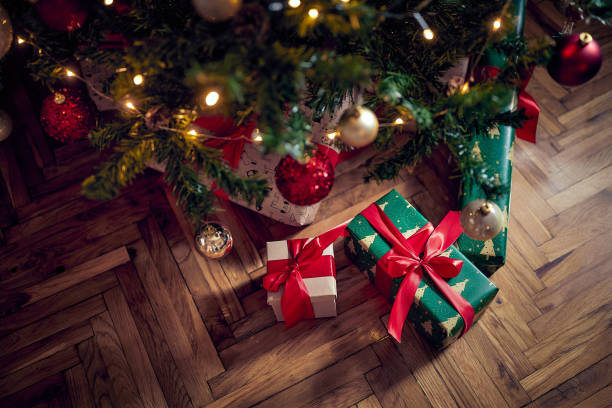 istock Christmas gift boxes. Christmas tree and gifts 1355871325