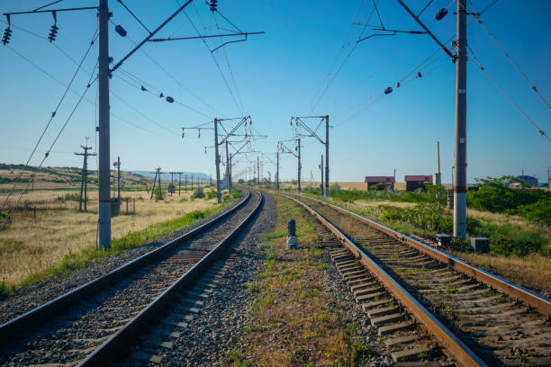 istock Two railway tracks stretching beyond the horizon 1355874583
