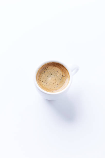 istock Cup of coffee on bright paper background. Copy space. 1355875038