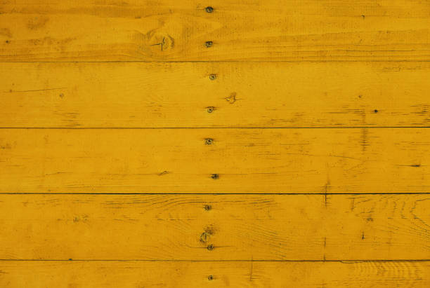 istock Yellow painted wooden planks background 1355875675