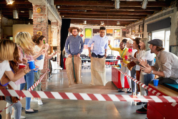 istock Group of work colleagues having fun competition together 1355875786