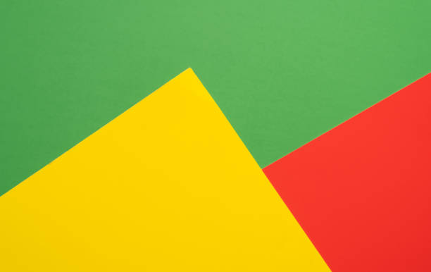 istock Abstract background with colored paper texture. Minimal composition on paper in red ,yellow,green colors 1355876830