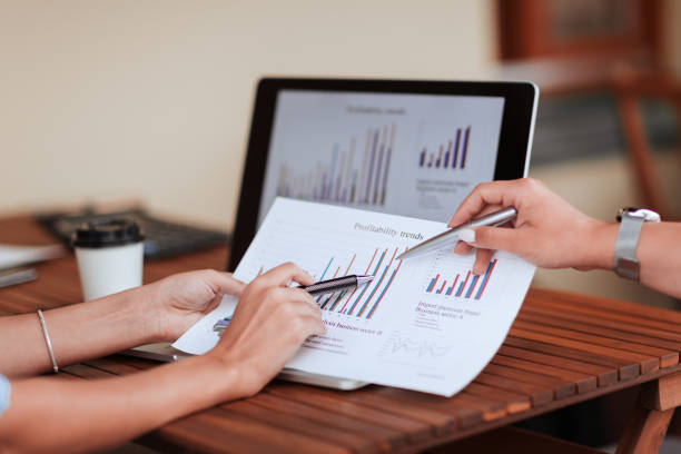 istock close up. business colleagues discussing the financial chart 1355884194
