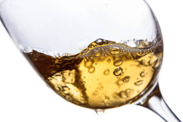 istock Glass of white wine on white background. 1355884459
