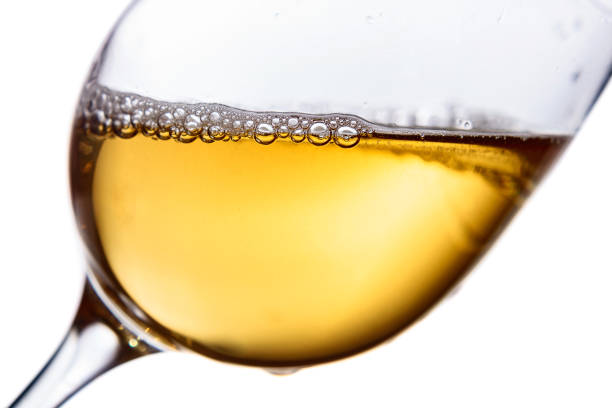 istock Glass of white wine on white background. 1355884460