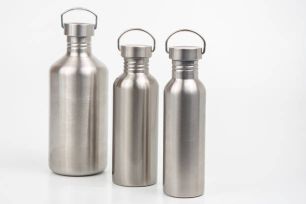 istock metal steel water flasks on white background. metal drinking utensils 1355886357
