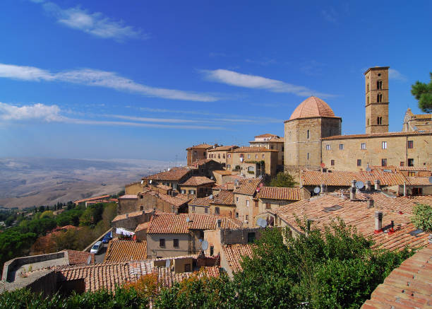 View To The Old Baptistery In Volterra On A Beautiful Spring Day With A Blue Sky And A Few Clouds