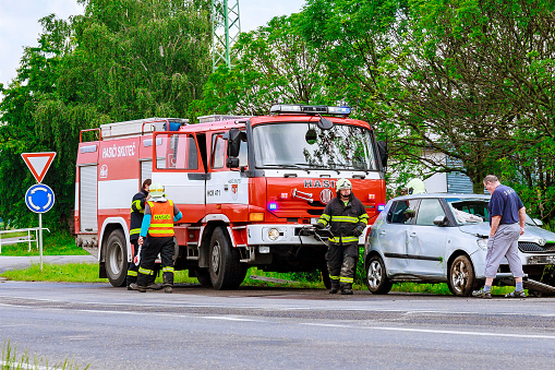 26 june 2020 Skutech Czech Republic,: Car accident, the car drove off the road. Rescuers and police officers provide assistance. Police car and fire engine.