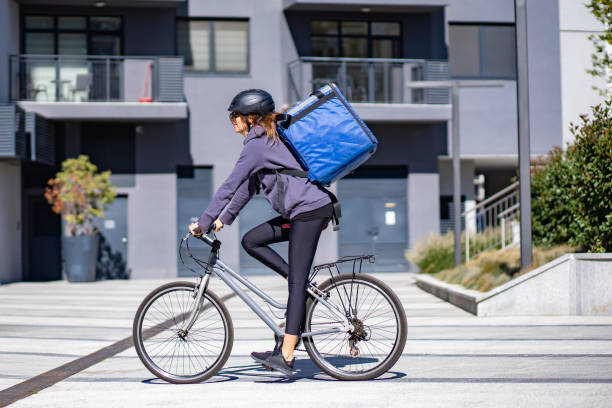 istock delivery person riding electric bicycle 1355903079