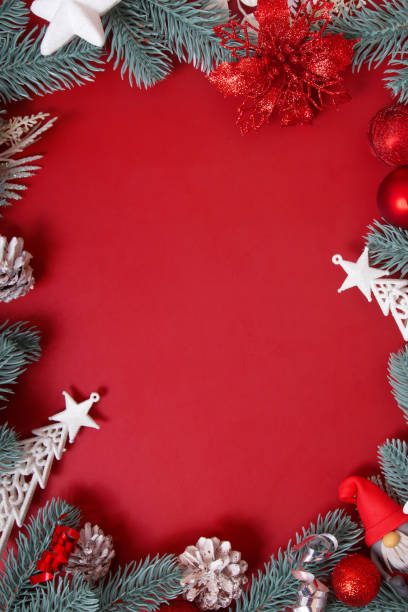 istock Frame made of Christmas decorations on a red background with copy space 1355904843